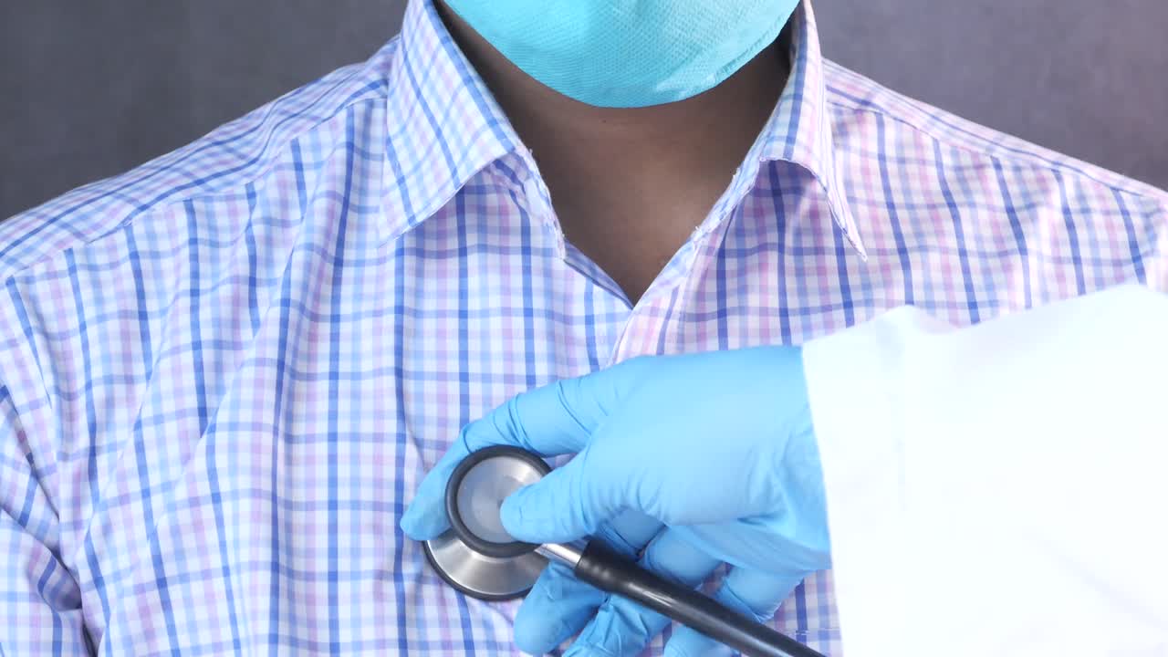 Doctor examining patient's heart