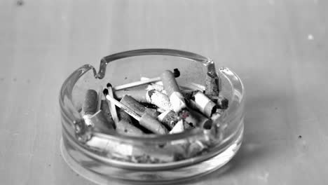 cigarette falling in ashtray