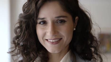 Closeup-shot-of-smiling-business-expert-posing-indoors