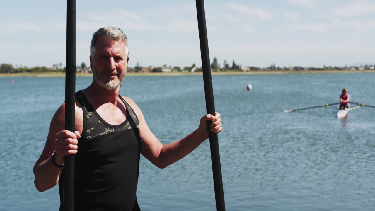 Portrait of senior caucasian man standing by a river