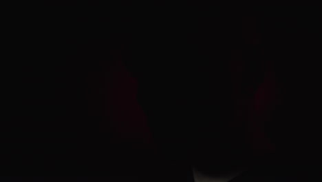dark image with red blurs