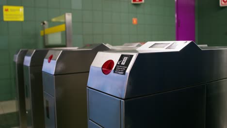 woman using subway turnstile