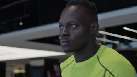 man exercising on treadmill at the gym