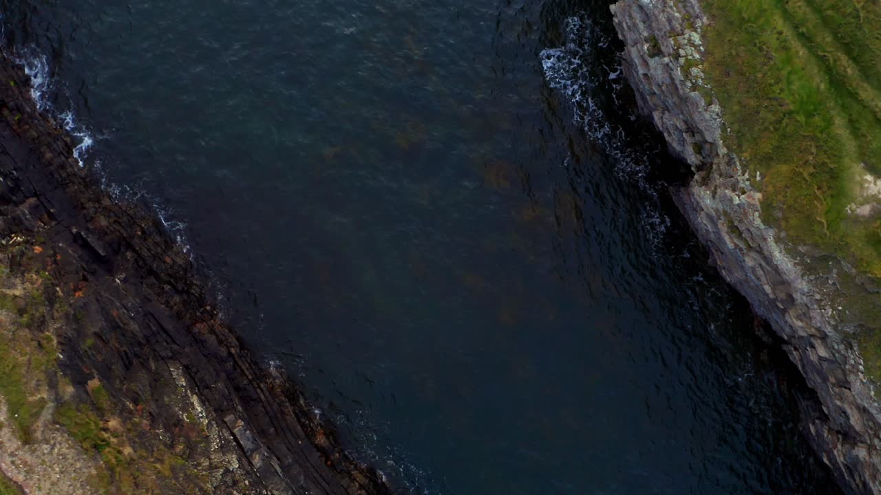 Aerial View of Dramatic Rocky Coastline and Ocean