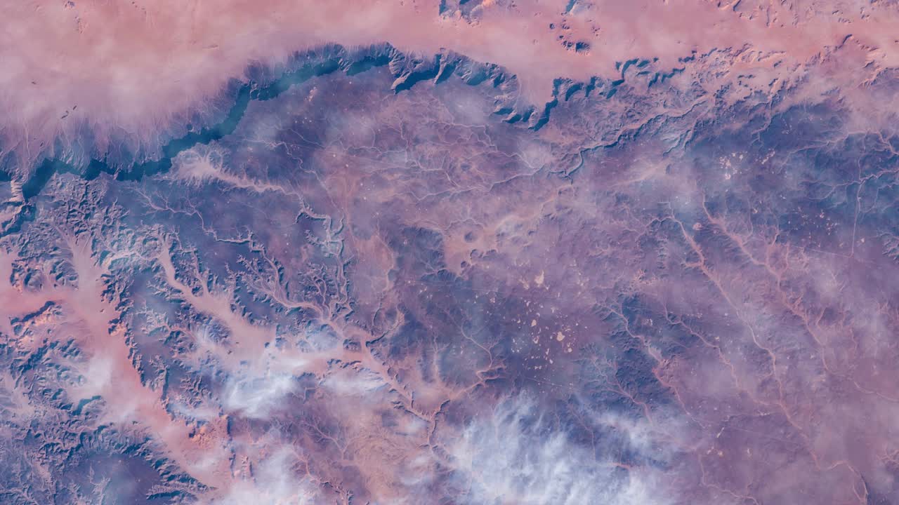 Flying over the earth on the ISS. Flying over desert, aerial view from space.