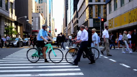 busy city street scene with pedestrians and cyclists
