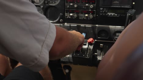 Close-up-shot-of-aircraft-pilot-maneuvering-the-airplane,-slow-motion