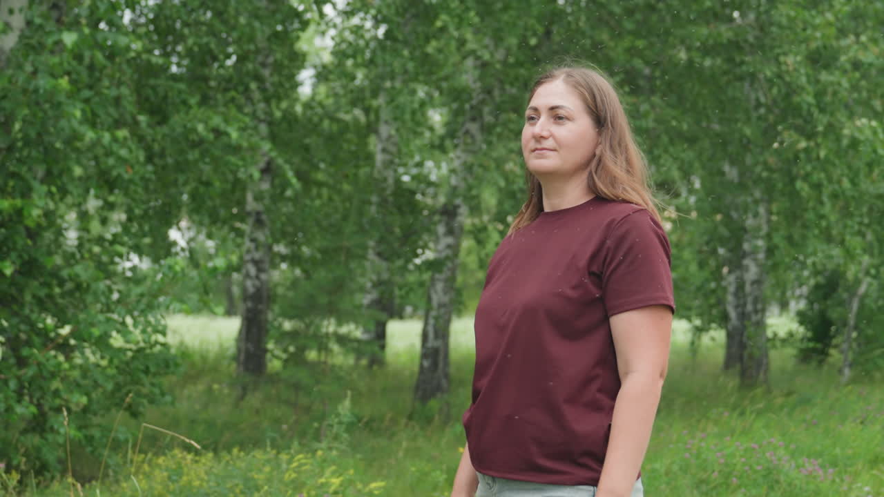 Energetic backyard badminton chase caucasian woman running through meadow to retrieve flying shuttlecock, dynamic swings and quick turns, hair in motion and determined expression, amateur athlete vibe