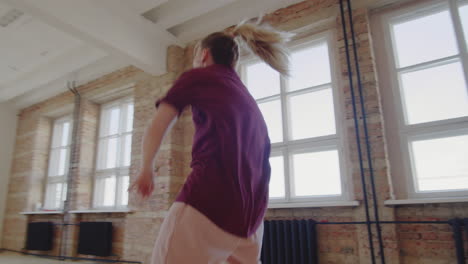 young woman giving dance class to multiethnic students