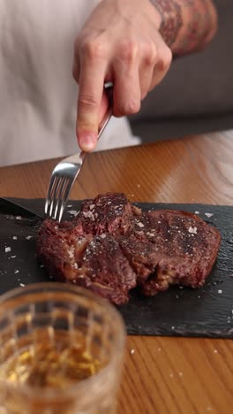 person eating a delicious steak