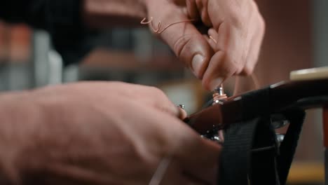 guitar repair process: installing guitar strings