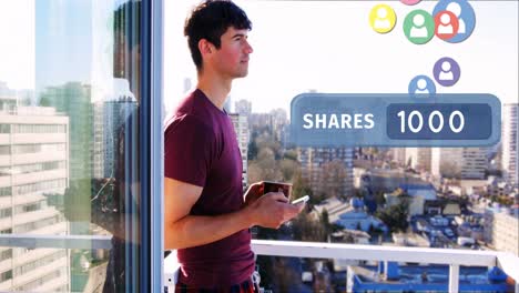 Man-leaning-on-veranda-rails-while-browsing-on-his-phone-4k