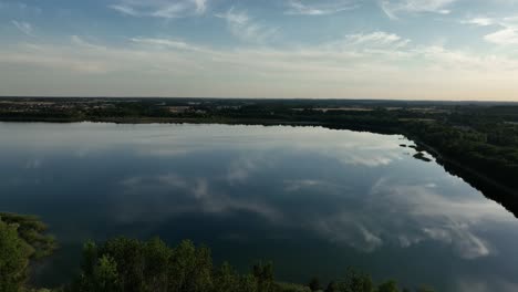 aerial-panoramic-view-of-Aeria-view-of-Osadnik-Gajówka-artificial-lake-in-Gmina-Przykona,-within-Turek-County,-Greater-Poland-Voivodeship,-Poland