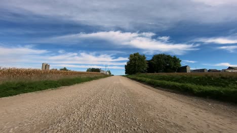 point of view footage while driving down a gravel road in rural iowa