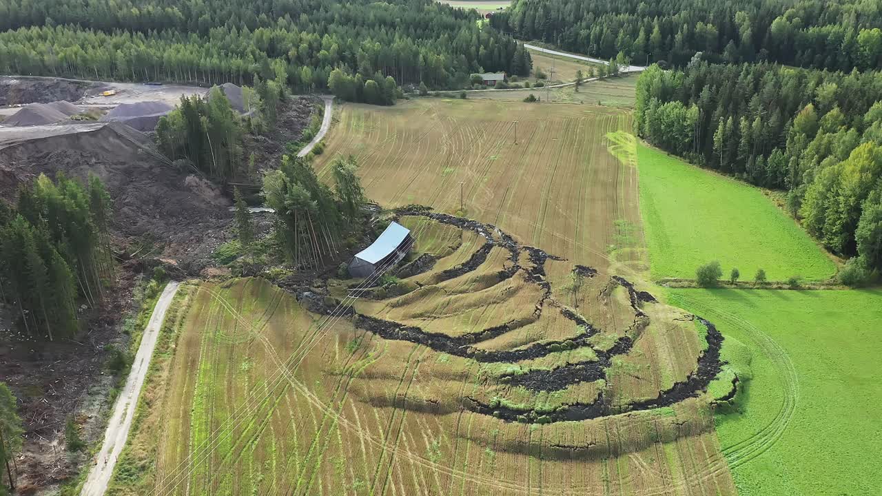 Large landslide near NCC operated open-pit construction rock quarry, dirt road and agricultural field and barn destroyed due to shifting soil. Heavy rains are suspected to contribute to the landslide.