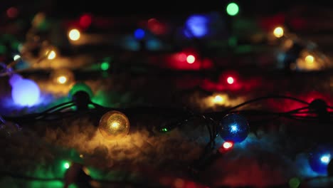 multi-colored christmas lights are fabulously lit on a black background,