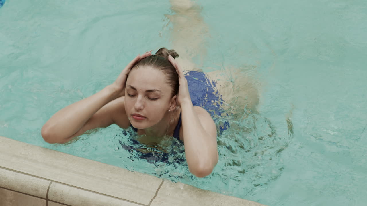 Female Professional Swimmer in Pool
