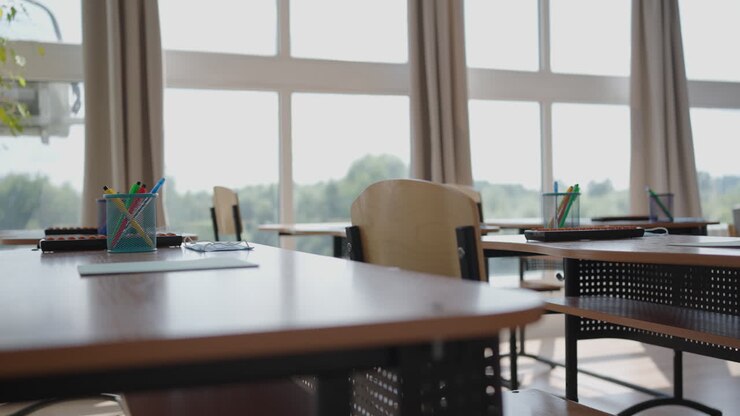 A school office during a pandemic with masks and social distance. The school is preparing to work in the mode of a coronavirus pandemic and epidemic. The interior of the school classroom