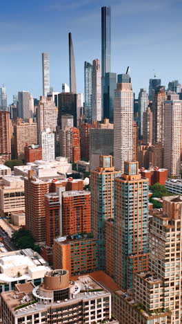 striking and diverse skyscrapers of new york midtown. beautiful architecture footage on sunny daytime. vertical video