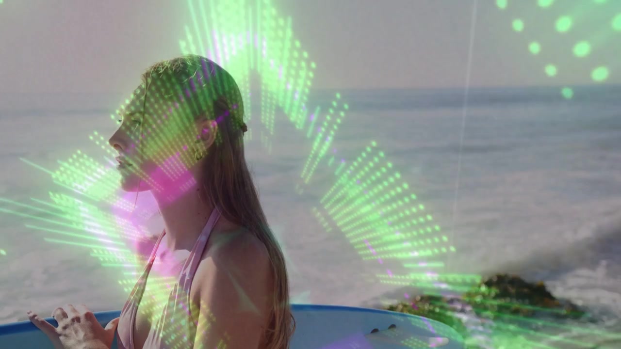 Woman standing in profile on shoreline holding surfboard, green purple lights pulsing, copy space