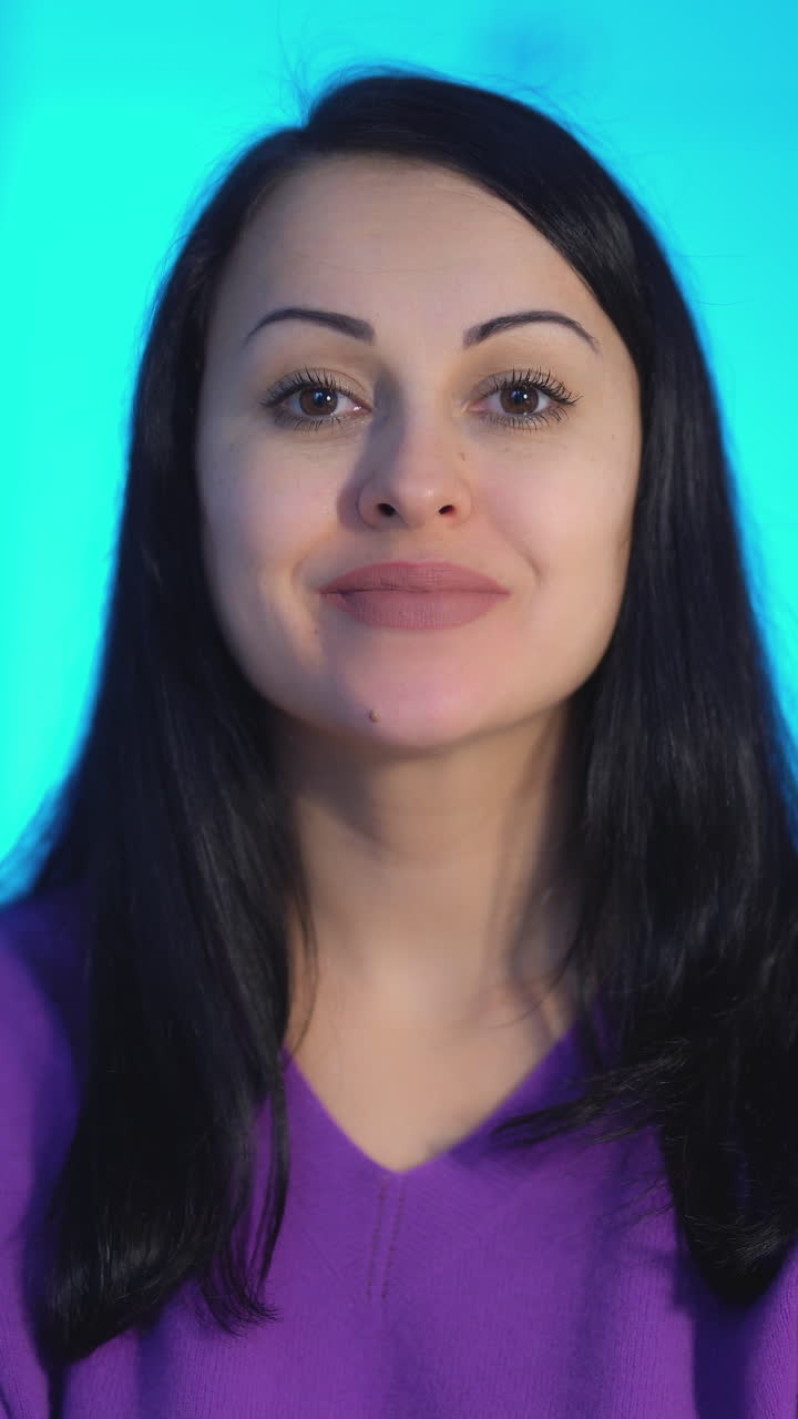 Portrait of beautiful woman. Portrait of woman making facial gymnastics