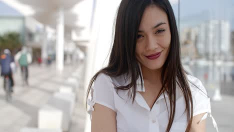 pretty young woman in a white summer top