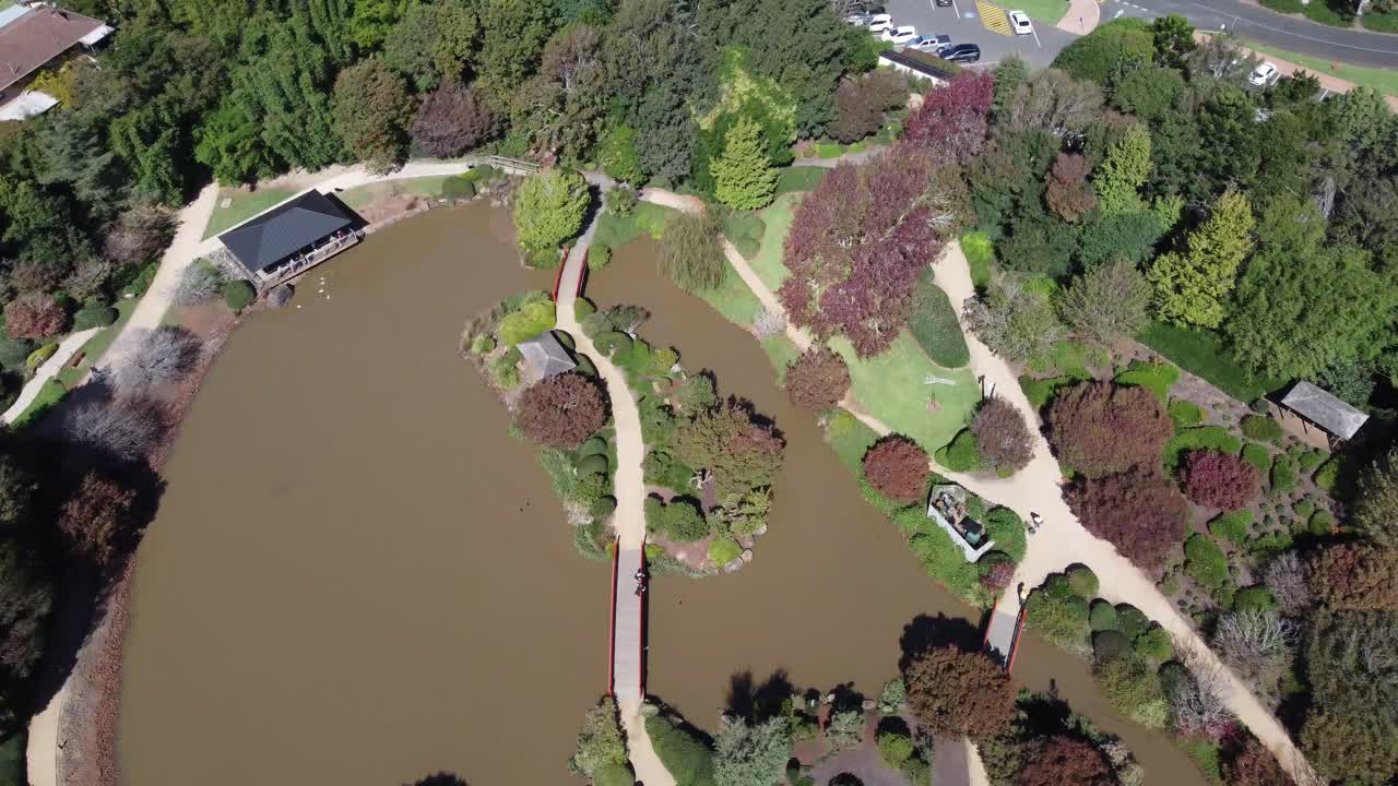 4K Aerial view of a Japanese Garden and approaching a carpark near by in Toowoomba, Australia