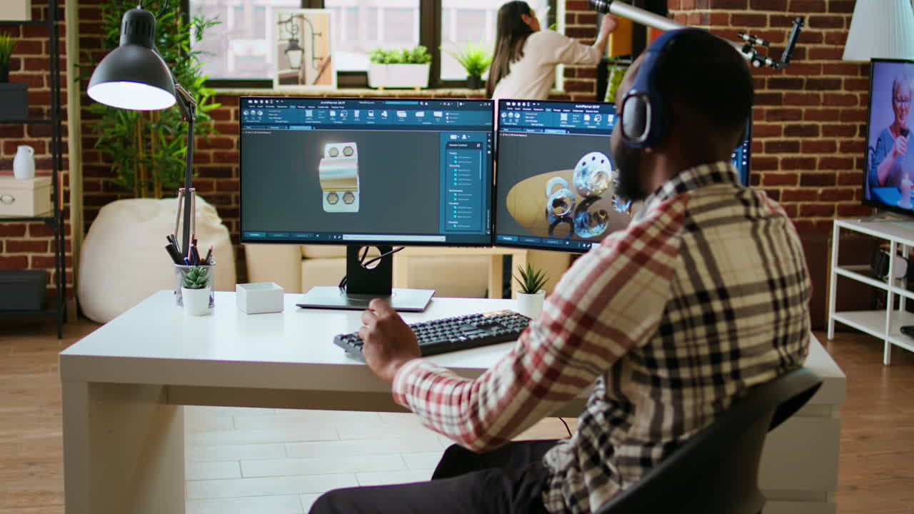 diseñador industrial afroamericano trabaja en software cad y escucha música