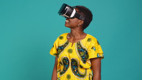 Young-happy-woman-working-with-a-virtual-reality-headset-in-studio