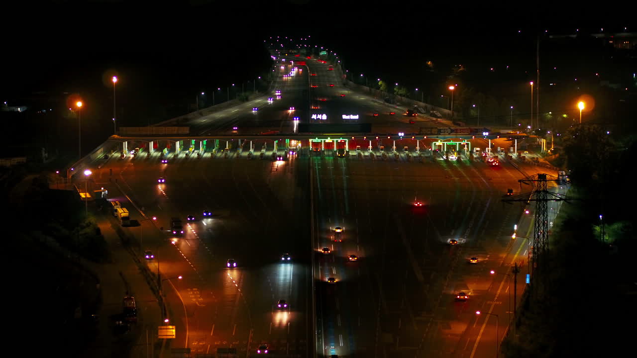 The night view of the tollgate of the west seoul highway to the drone shot, move back