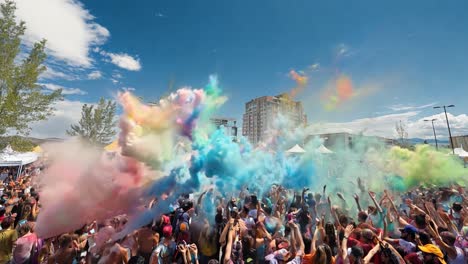 vibrant outdoor music festival with crowd and colorful powder explosion