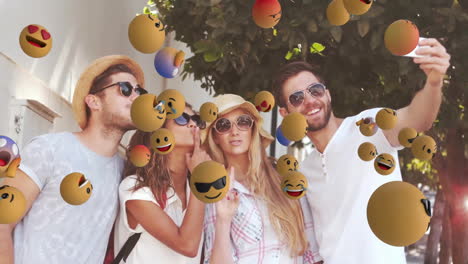 amigos tomando selfies, rodeados de emoji flotantes animados