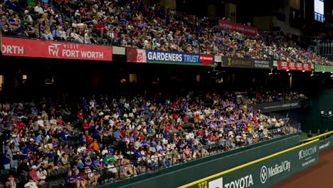 slow motion landscape of crowd supporters and fans in baseball sports stadium grandstand seating at arlington globe life field texas usa america major league