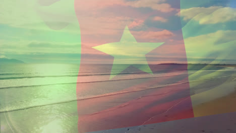 animation of flag of cameroon blowing over beach landscape