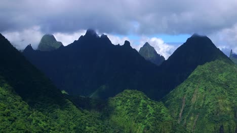 breathtaking aerial view of lush green mountains and clouds