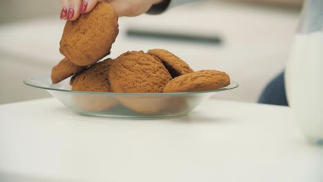 4k slow motion video of hand taking one biscuit.