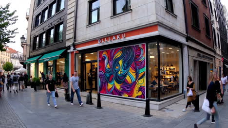 city street scene with shops and pedestrians