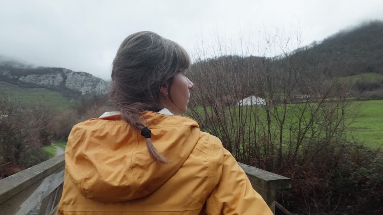 Woman Taking Photos of Nature and Mountains on Phone, Bridge in Asturias, Spain