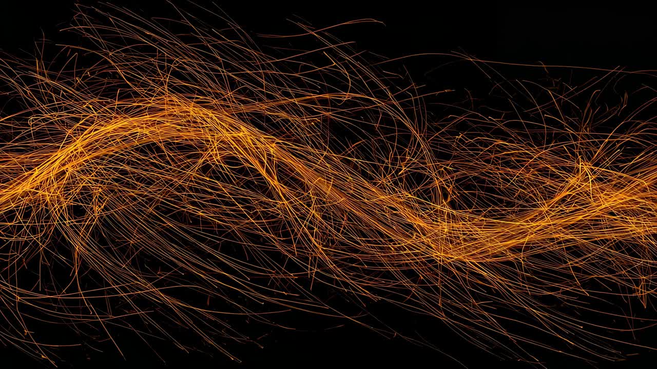 Partendo da sinistra, un nastro arancione incandescente si snoda verso destra su uno sfondo nero, spargendo scintille