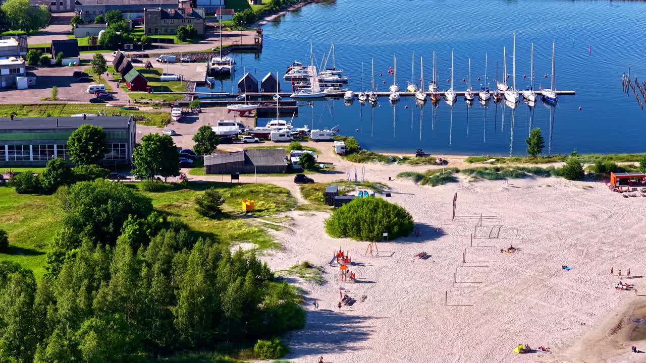 Aerial view of Yacht pier in Engure and nearby beach at Baltic Sea coast in Latvia
