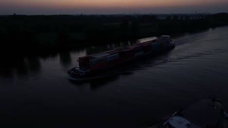 darkened waters: cargo boat nightfall voyage
