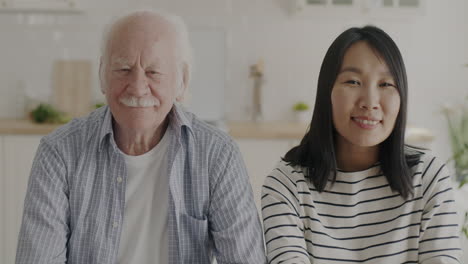portrait of a senior man and young woman