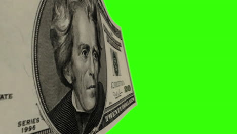 a 20 dollar bill on a green screen background