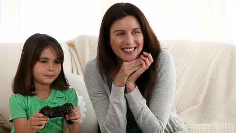 Mother-and-daughter-playing-video-games-