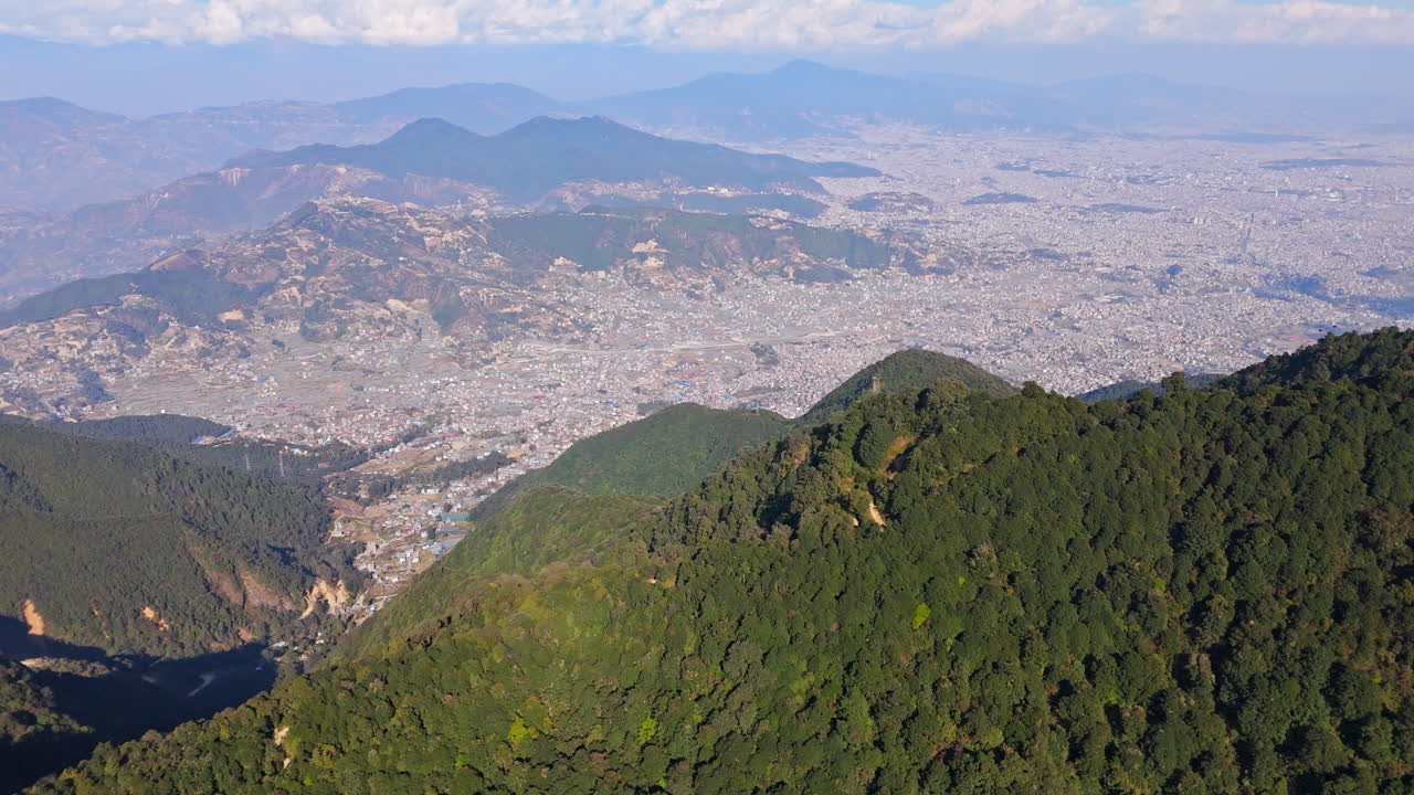 Aerial panning overview of the cityscape of Kathmandu from Chandragiri, Nepal