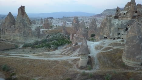 mushroom shaped fairy chimneys in red valley, cappadocia, turkey