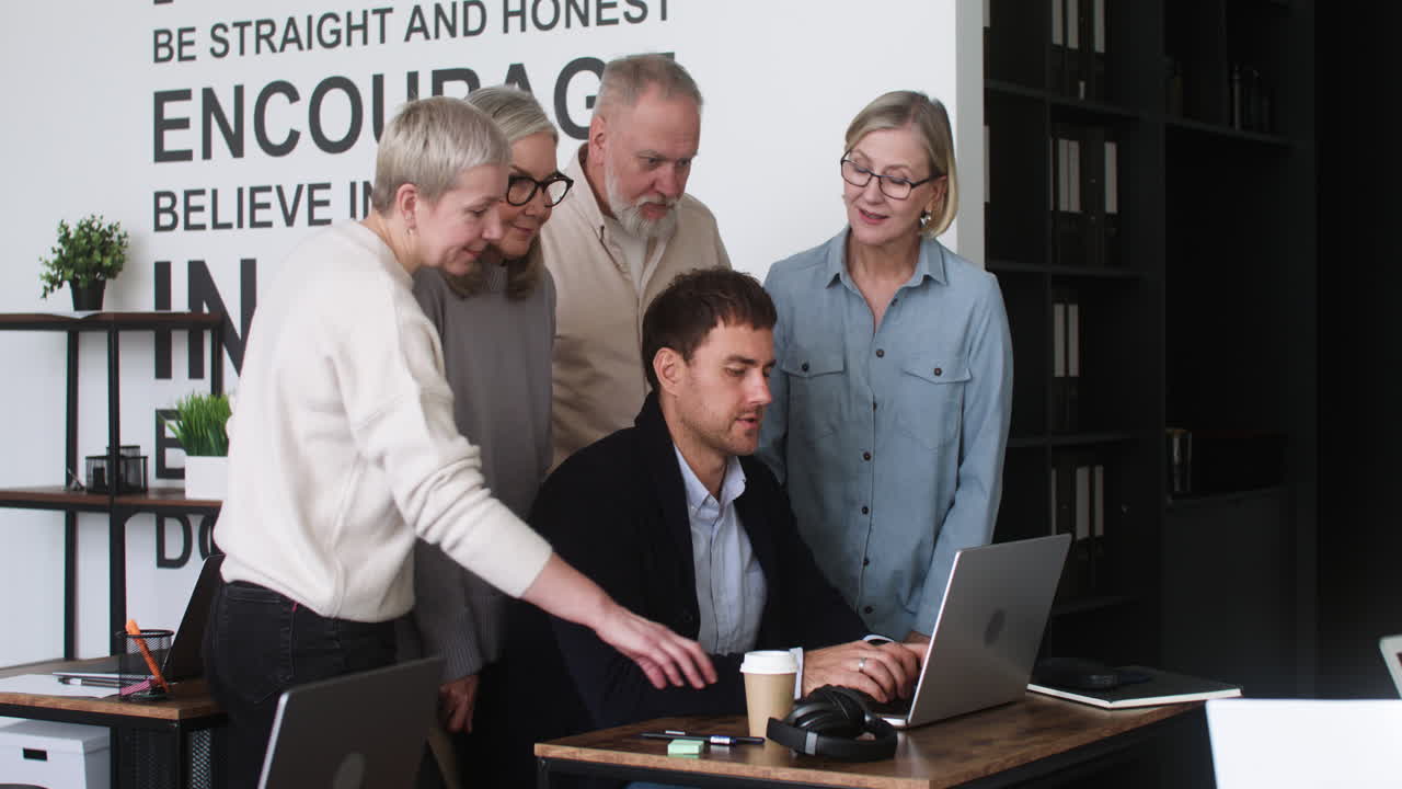 Male teacher and students in classroom