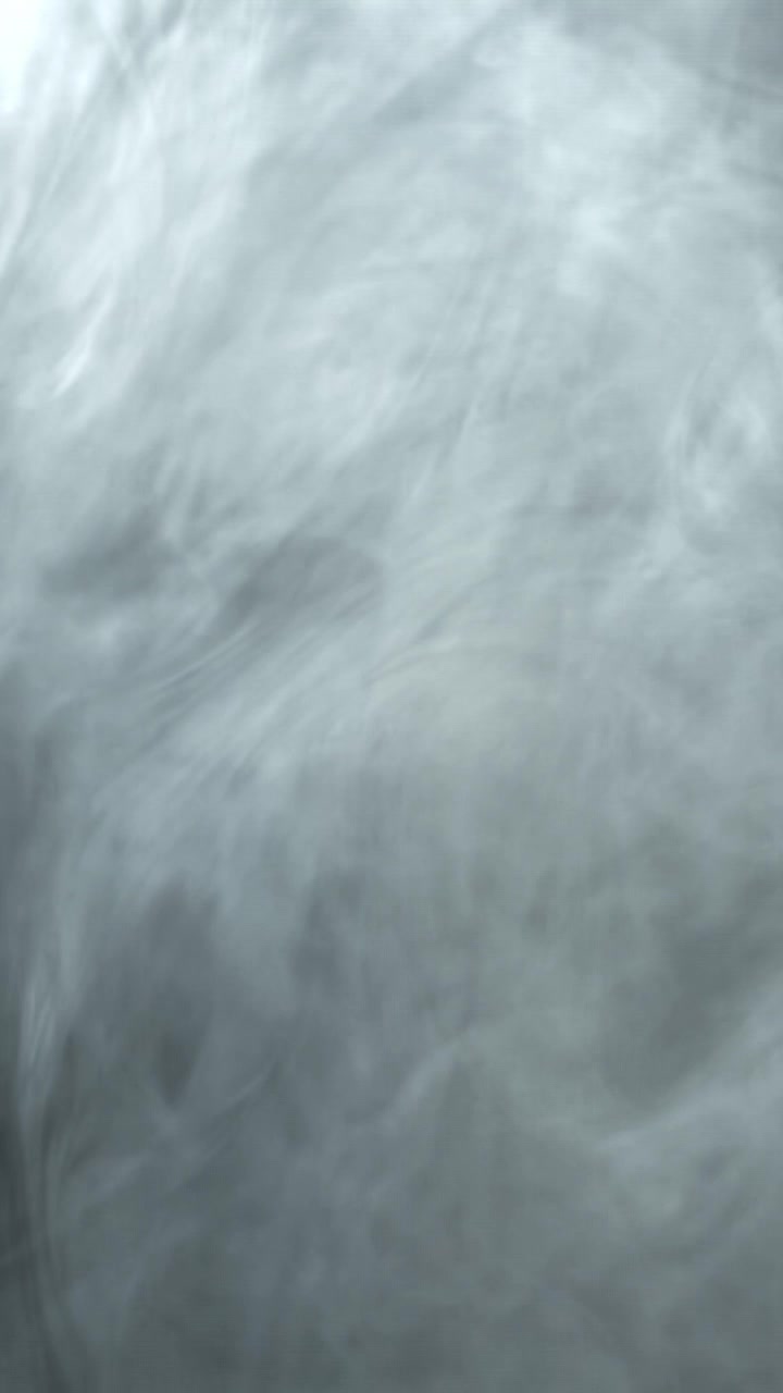 Abstract White Smoke Flowing and Swirling on Dark Background
