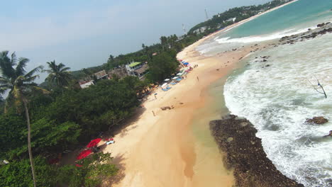 fpv planned shot, exploring stunning golden sands beach of beautiful island, sri lanka