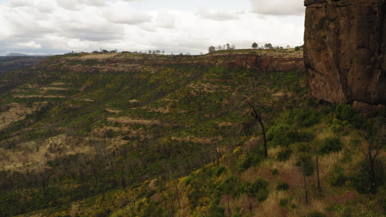 Butte Creek California, canyon reveal behind rocky clifftop, aerial view